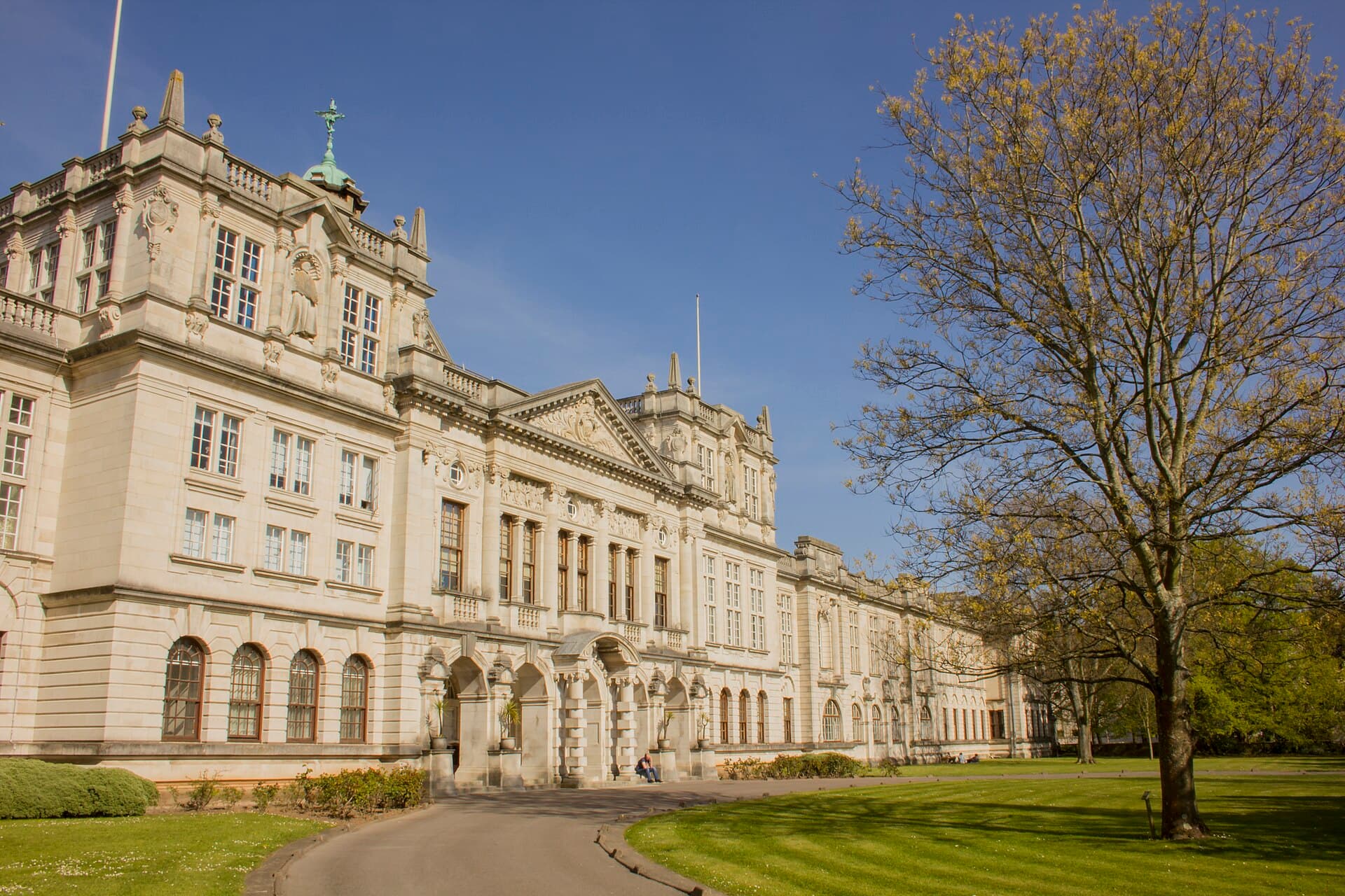 Cardiff University's Portland stone Main Building above the lawn and drive in front of it