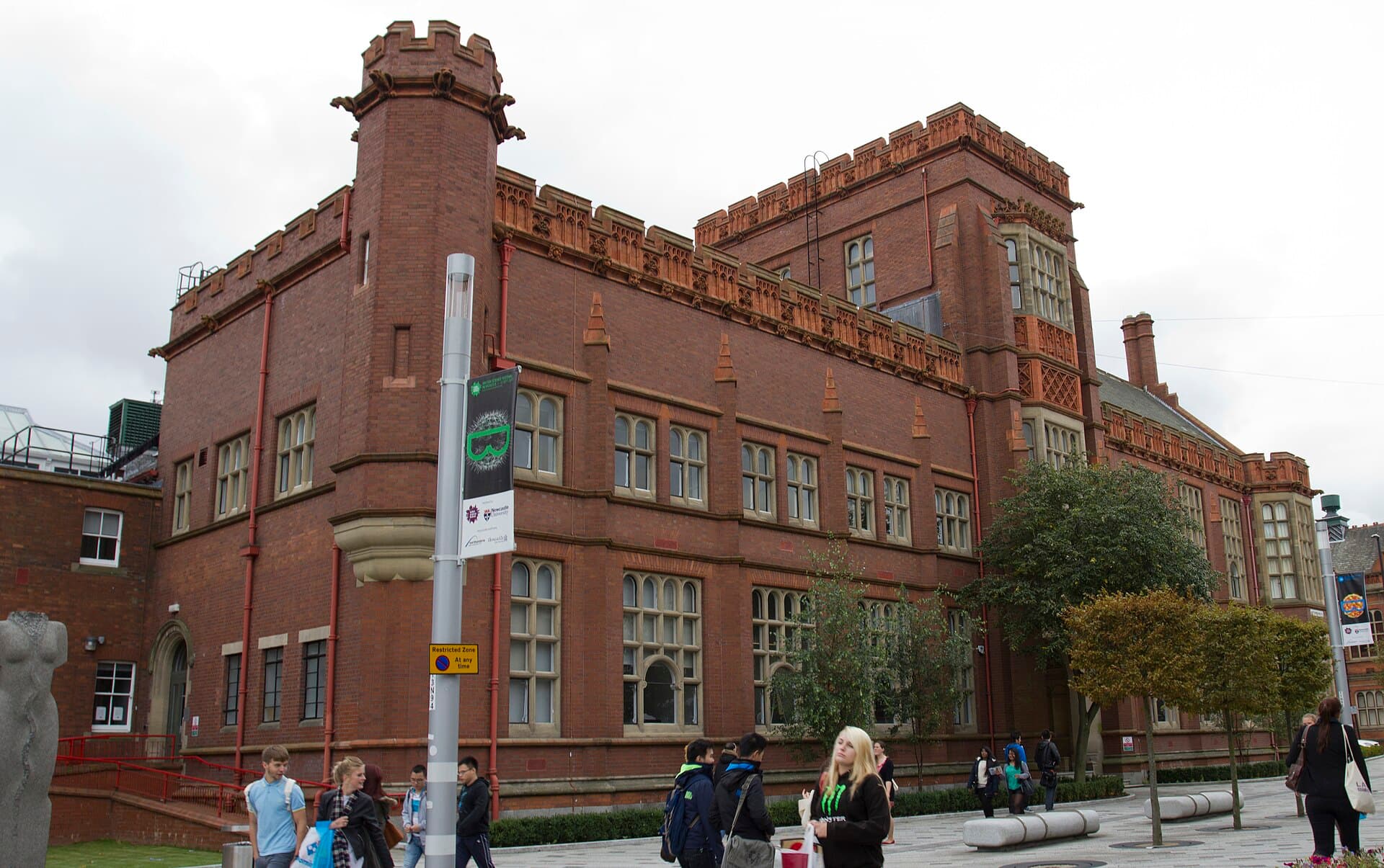 Northumbria University's red-brick Sutherland Building above the student square in front of it