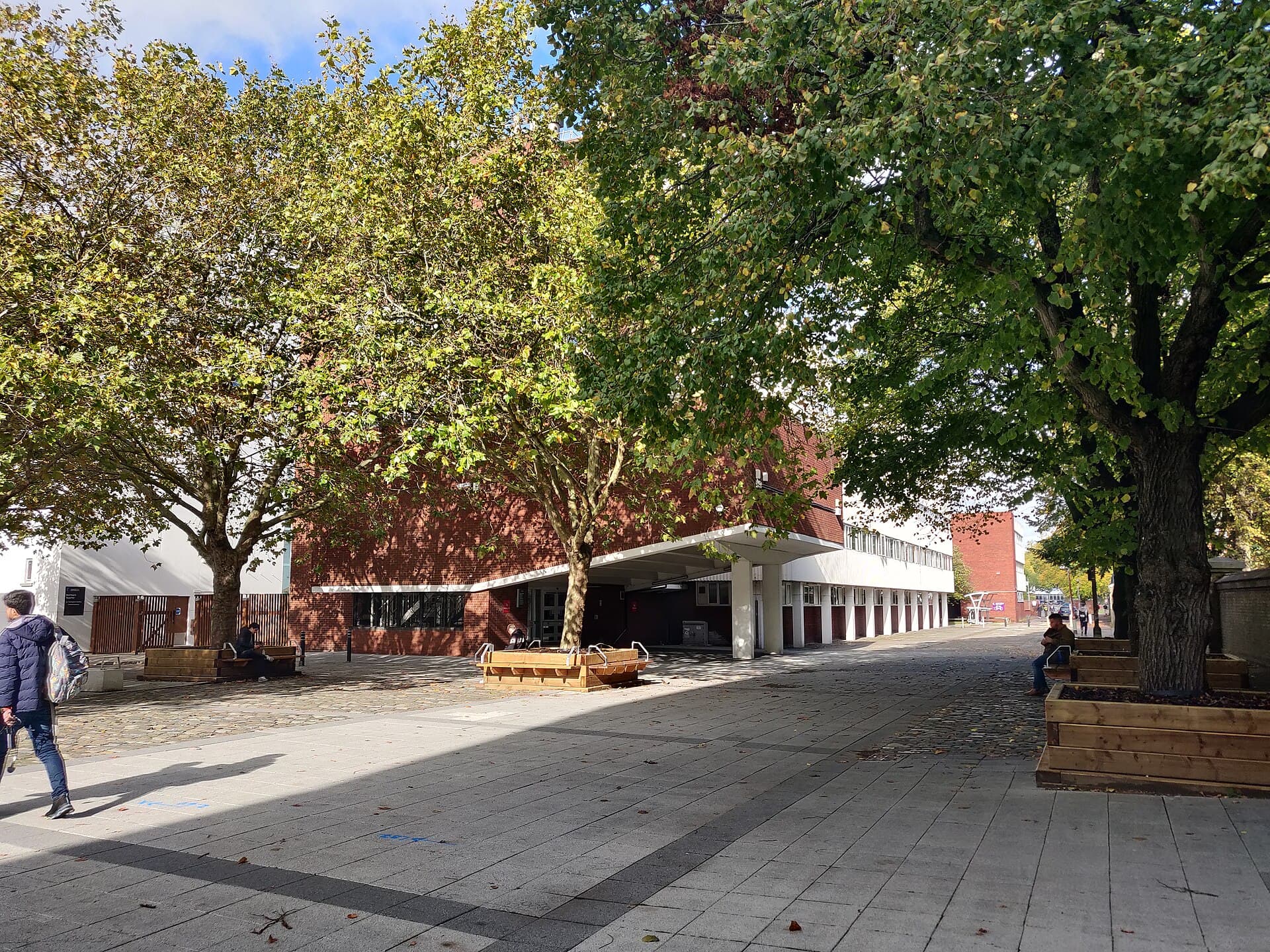 The University of Portsmouth's Buckingham Building and the tree-lined pedestrian square in front of it
