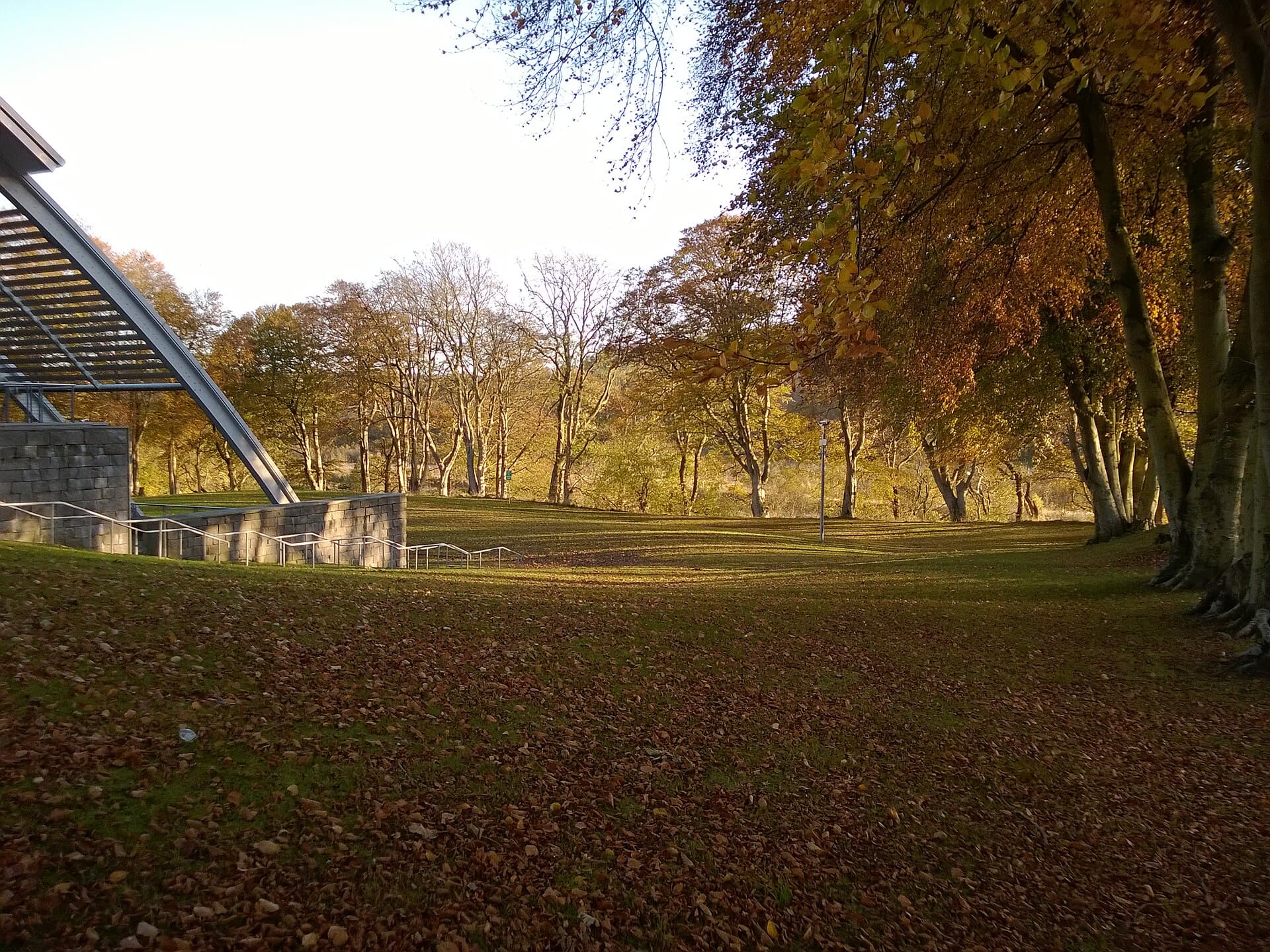 Autumn on Robert Gordon University's Garthdee campus, with the stone and glass edge of a building at the left